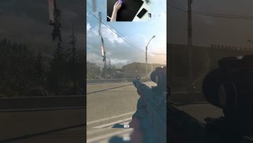 Gamer playing FPS, sniper rifle aiming on road.