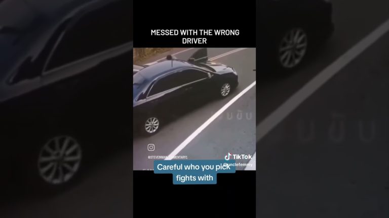 Black car on roadside, open door, traffic caution.