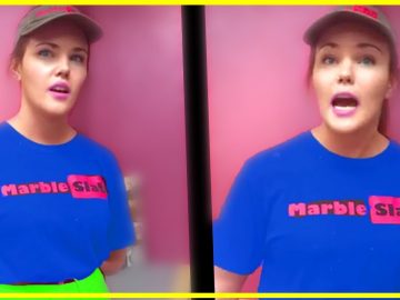 Person in Marble Slab uniform standing, pink background