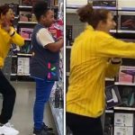 Two women laughing and dancing in a store.