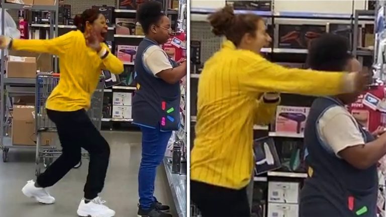 Two women laughing and dancing in a store.