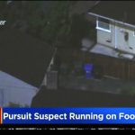 News helicopter view of police pursuit in residential area.
