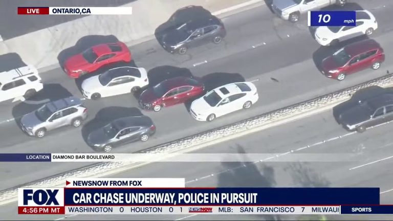 Aerial view of car chase on highway, Ontario, CA.