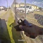 Body camera footage showing an officer shooting.