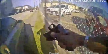 Body camera footage showing an officer shooting.