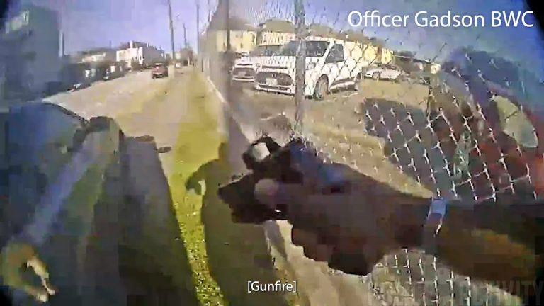 Body camera footage showing an officer shooting.