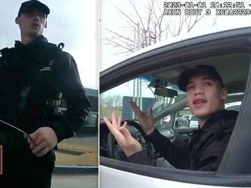 Police officer interacting with person in car.