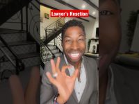 Smiling person gives okay gesture indoors.