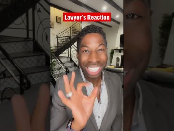 Smiling person gives okay gesture indoors.