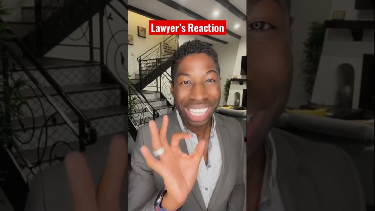 Smiling person gives okay gesture indoors.