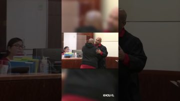 Judge embraces man in courtroom.