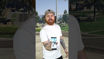 Person holding phone in outdoor setting.