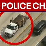 Live police chase involving white flatbed truck