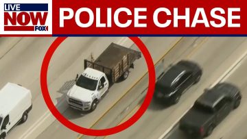 Live police chase involving white flatbed truck
