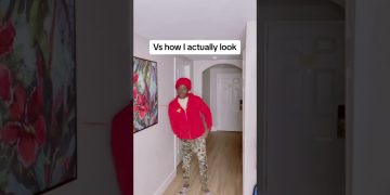 Person in red hoodie in hallway parody scene.