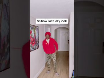 Person in red hoodie in hallway parody scene.