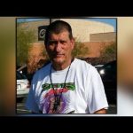 Man in graphic t-shirt outdoors, close-up