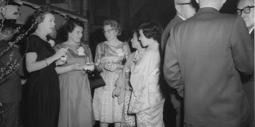 People socializing at a formal event.