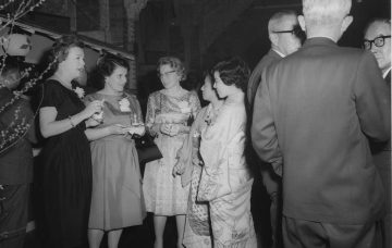 People socializing at a formal event.