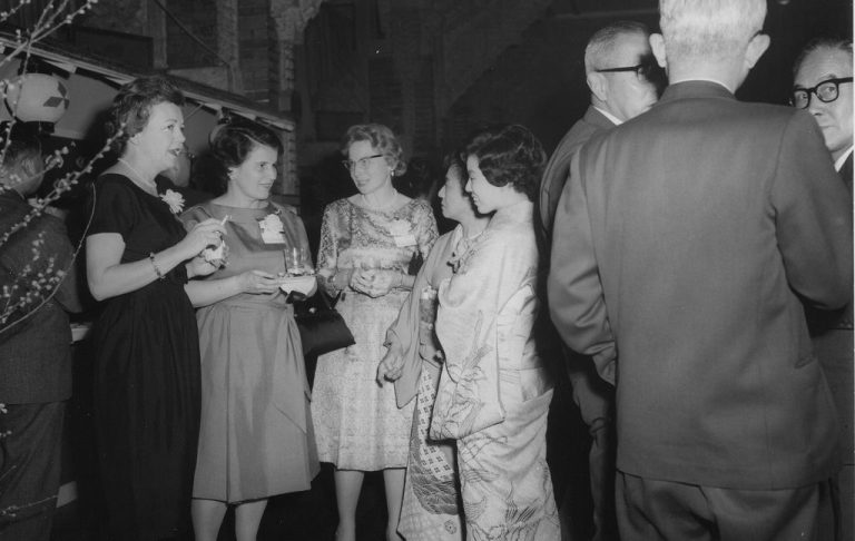 People socializing at a formal event.