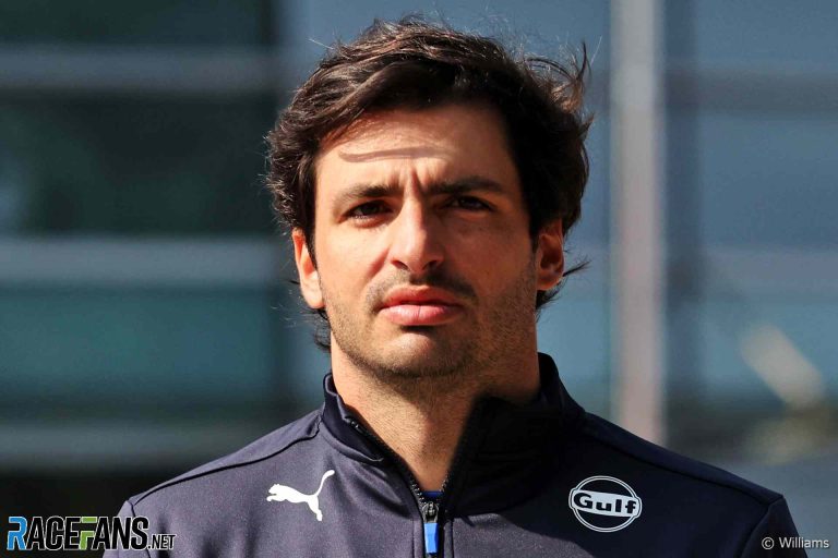 Person in Puma jacket with Gulf logo.